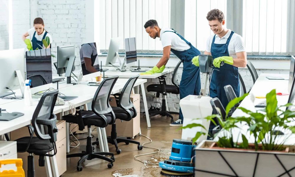 multicultural-team-of-cleaners-working-in-modern-open-space-office.jpg